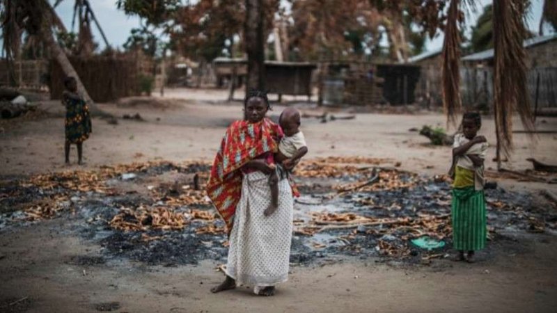 A woman stands in a burned out area after an extremist attack on the village of Aldeia da Paz, Mozambique, Aug. 24, 2019. (AFP/Getty Images via CNA)