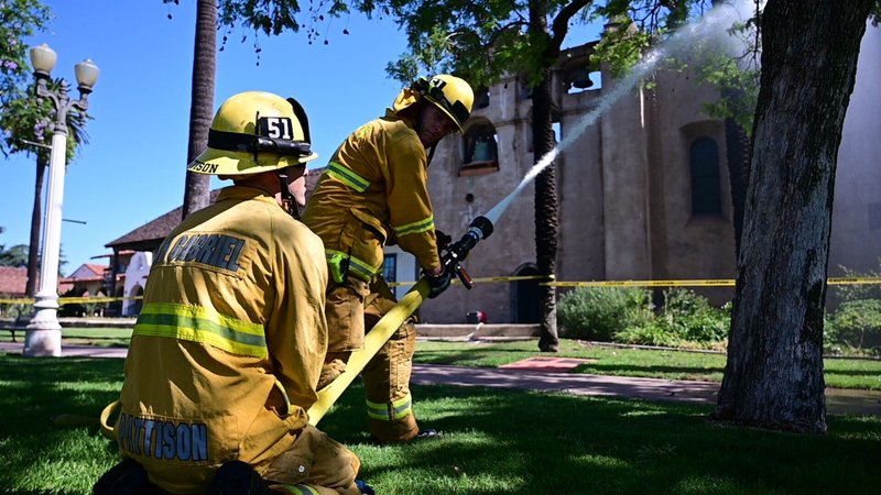 Firefighters at the scene of the fire at San Gabriel Mission the morning of Saturday, July 11. (John McCoy/Angelus)
