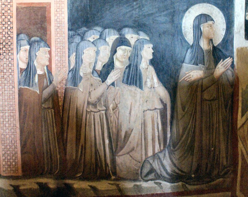 Fresco of Saint Clare and sisters of her order, church of San Damiano, Assisi. (Wikipedia)