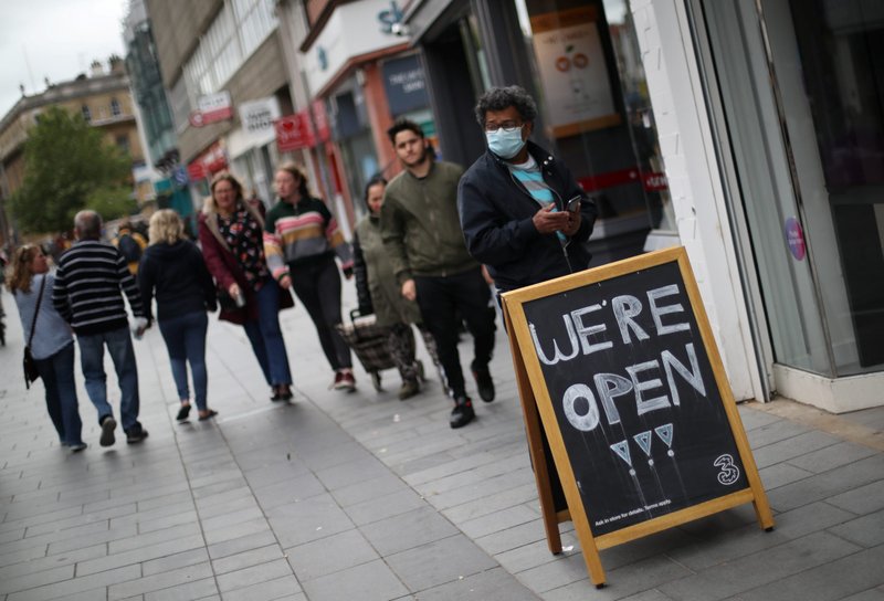 A "We're open" sign on the street June 29 in Leicester, England, as more regions of the country emerge from lockdown during the coronavirus pandemic. (Catholic News Service/Carl Recine, Reuters)