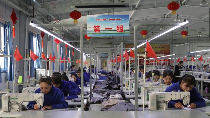 Uyghur women work in a cloth factory April 27, 2019, in Hotan county, Xinjiang province, China. (Azamat Imanaliev/Shutterstock)