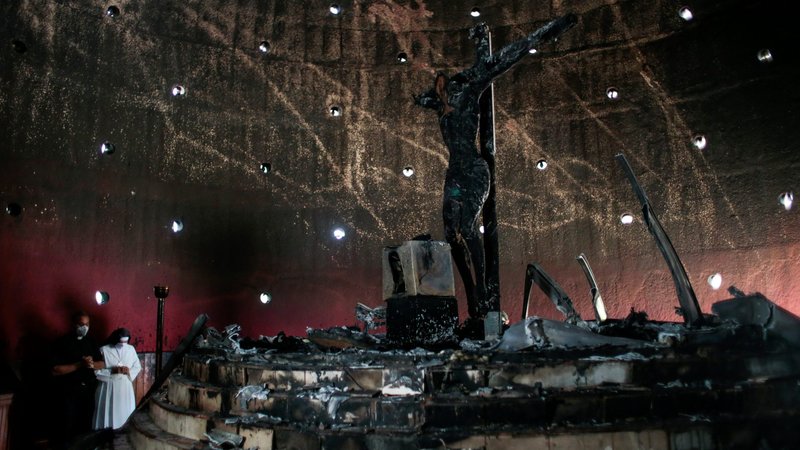 A priest and nun pray in the Blood of Christ Chapel at the Metropolitan Cathedral in Managua, Nicaragua, July 31, 2020, after the chapel was destroyed in an arson attack. (CNS photo/Oswaldo Rivas, Reuters)
