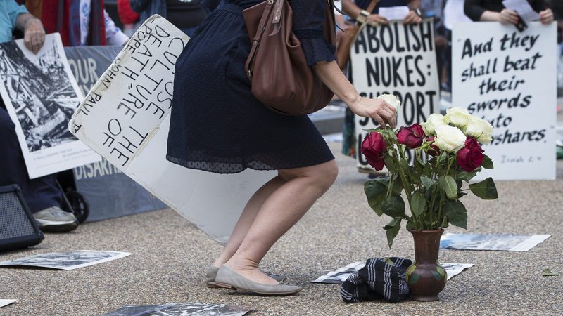 In this 2018 file photo, peace activists hold a Catholic prayer service of repentance near the White House for the use of nuclear weapons on Japan during World War II. Bishops from Japan and the U.S. explored Catholic efforts to end the danger of nuclear weapons during an Aug. 3, 2020, webinar commemorating the 75th anniversary of the nuclear bomb drop on Hiroshima and Nagasaki. (CNS photo/Tyler Orsburn)