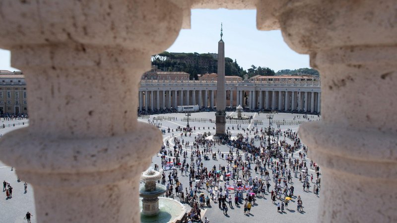 The crowd in St. Peter's Square watches as Pope Francis leads the Angelus from the window of his studio overlooking the square at the Vatican Aug. 9, 2020. The pope said calling out to God for help is key during periods of doubt and fear. (CNS photo/Vatican Media)