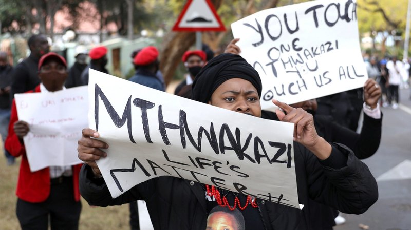 Protesters hold placards during a protest against the Zimbabwe government's record on corruption and human rights abuses, outside the Zimbabwe Embassy in Pretoria, South Africa, Aug. 7, 2020. (CNS photo/Siphiwe Sibeko, Reuters)