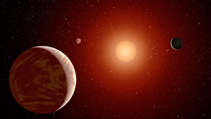 This NASA artist's concept illustrates a young, red dwarf star surrounded by three planets. (CNS illustration/NASA, PL-Caltech)