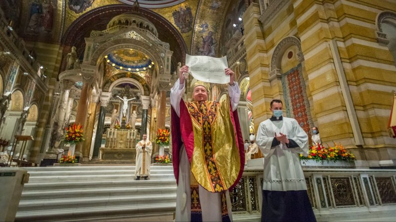 Archbishop Mitchell T. Rozanski of St. Louis holds the mandate from Pope Francis that proclaims him the 10th Archbishop of the Archdiocese of St. Louis Aug. 25, 2020. (CNS photo/Lisa Johnston, St. Louis Review)