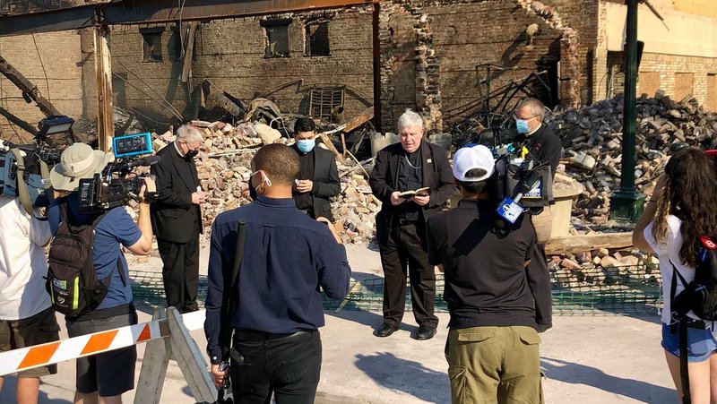 Archbishop Jerome E. Listecki of Milwaukee prays Aug. 27, 2020, at one of the Kenosha, Wis., sites destroyed during violent protests that followed the shooting of Jacob Blake, a Black man, by police four days earlier. Authorities said Blake was shot seven times in the in the back Aug. 24 as while three of his children looked on. (CNS photo/courtesy Jerry Topczewski, Archdiocese of Milwaukee)