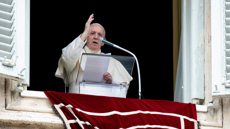 Pope Francis delivers his blessing as he leads the Angelus from the window of his studio overlooking St. Peter's Square at the Vatican Aug. 30, 2020. (CNS photo/Vatican Media)