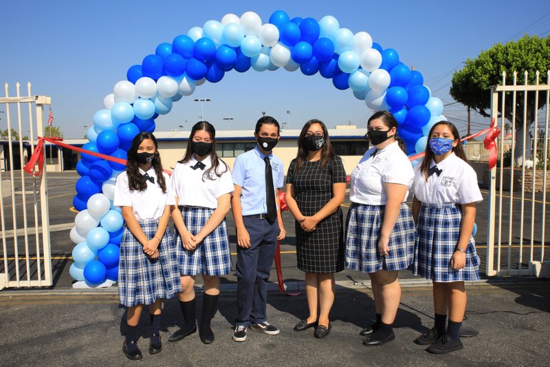 Eighth-grade teacher Stacy Acuna with students from St. Joseph School in La Puente at an Aug. 28 back-to-school ceremony and blessing for the school’s newly renovated K-8 building. (DAVID AMADOR RIVERA)