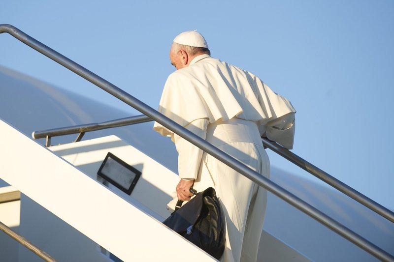 Pope Francis boards the papal plane from Rome, Italy, to travel to Kenya, Africa, during his first apostolic visit to the country on Nov. 25, 2015. (L'Osservatore Romano)