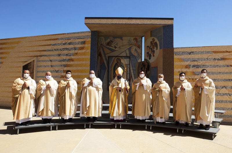Archbishop Gomez (center) with the newly ordained priests for the Archdiocese of Los Angeles. (Victor Alemán)