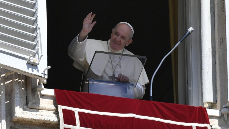 Pope Francis waves from the window of the Apostolic Palace. (Vatican Media)