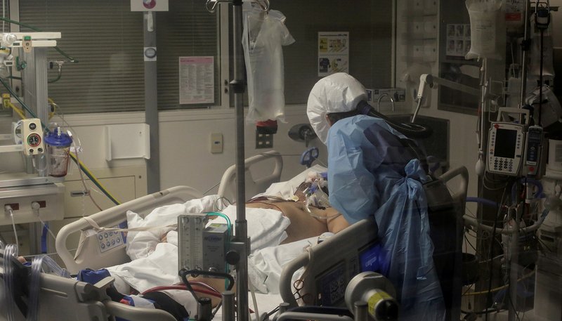Nurse Leah Silver cares for a patient sick with the coronavirus in the COVID-19 ICU at the University of Washington Medical Center-Montlake in Seattle April 24, 2020. (CNS photo/David Ryder, Reuters)
