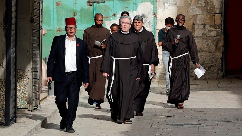 Franciscan Father Francesco Patton, custos of the Holy Land, center, and others, are pictured in a file photo walking toward the Church of the Holy Sepulcher in Jerusalem's Old City. (CNS photo/Ammar Awad, Reuters)