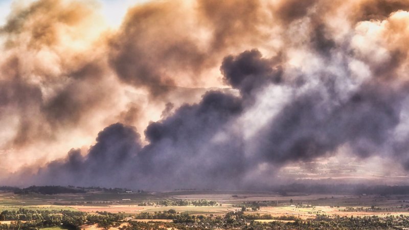 Smoke rises from a fire Sept. 8, 2020, that destroyed the small towns of Talent and Phoenix, Oregon. (CNS photo/Marc Salvatore, Catholic Sentinel)