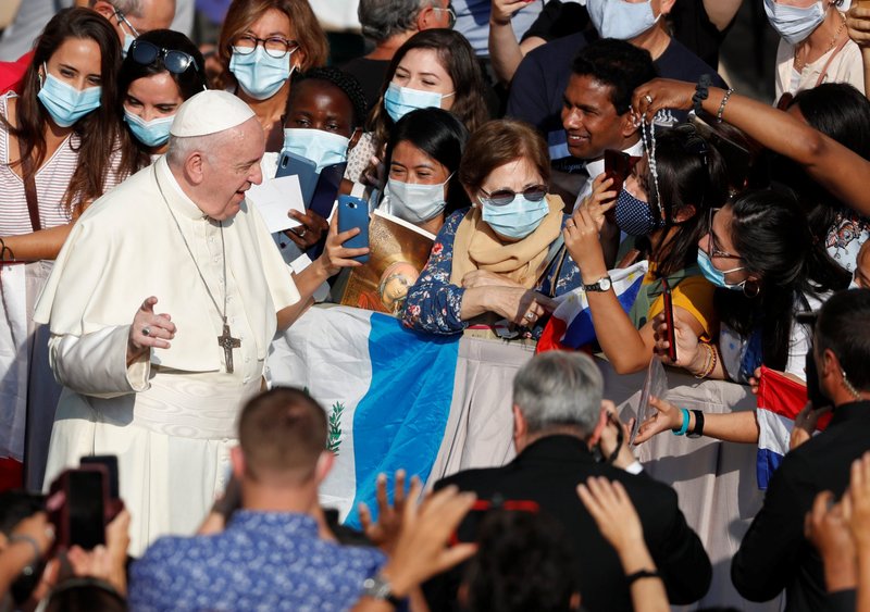 Pope Francis greets the crowd as he arrives for his general audience in the San Damaso courtyard at the Vatican Sept. 16, 2020. (CNS photo/Yara Nardi, Reuters)