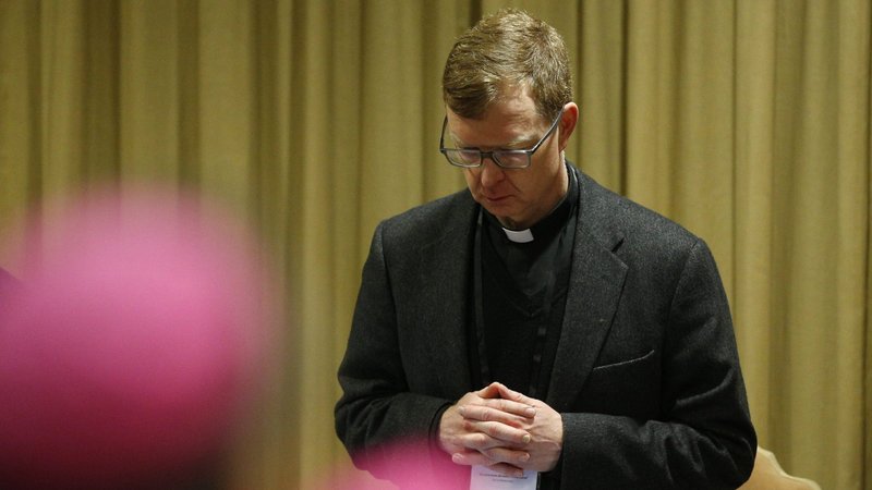 Jesuit Father Hans Zollner, a member of the Pontifical Commission for the Protection of Minors, prays during the 2019 meeting at the Vatican on protecting young people in the church. (CNS photo/Paul Haring)