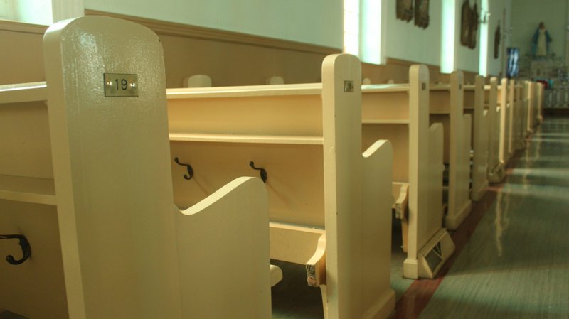 Empty pews are pictured in a file photo at St. Irenee's Catholic church in the Charlevoix region, near Quebec City. During the COVID-19 pandemic, the Quebec government is limiting churches to 50 people inside, 25 in riskier regions. (CNS photo/Philippe Vaillancourt, Presence)