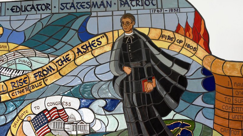 A mural of Father Gabriel Richard is seen in this undated photo inside the TCF Center in downtown Detroit. The priest shepherded the Basilica of Ste. Anne de Detroit for more than 30 years in the early 1800s. (CNS photo/Detroit Catholic)