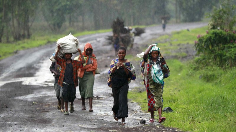 Displaced people are seen in a file photo along a road near Goma, Congo. The World Day of Migrants and Refugees is celebrated Sept. 27, 2020. (CNS photo/Thomas Mukoya, Reuters)