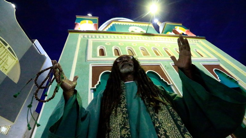 A Muslim man is pictured in a file photo praying outside a mosque in Khartoum, Sudan. Sudanese bishops are welcoming a new declaration signed in early September that separates religion and state. (CNS photo/Mohamed Nureldin Abdallah, Reuters)