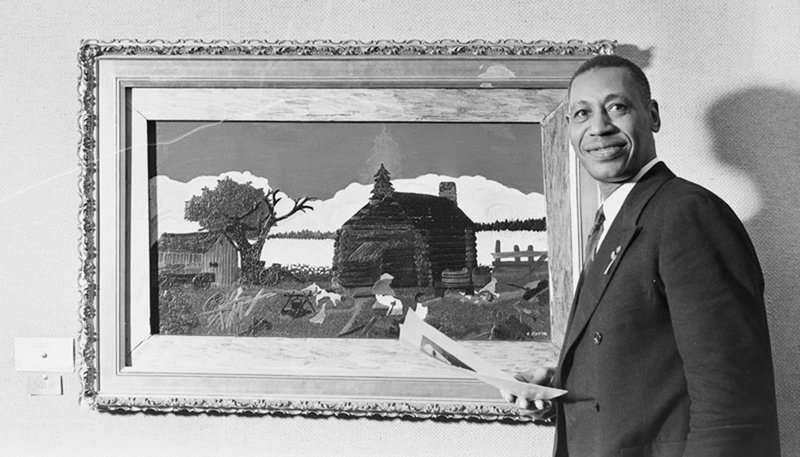 "Horace Pippin Standing in Front of His Artwork," 1945, photographed by Joseph Janney Steinmetz. (Harvard Art Museums/Fogg Museum, Transfer from the Carpenter Center for the Visual Arts, American Professional Photographers Collection)