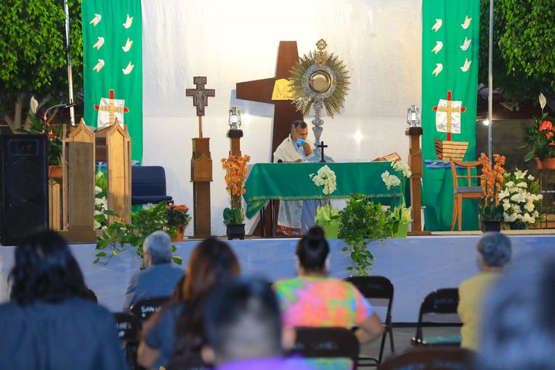Fr. Jesus Herrera Garcia leads outdoor Adoration Saturday, Sept. 12 at Santa Isabel Catholic Church in East LA. (David Amador Rivera)