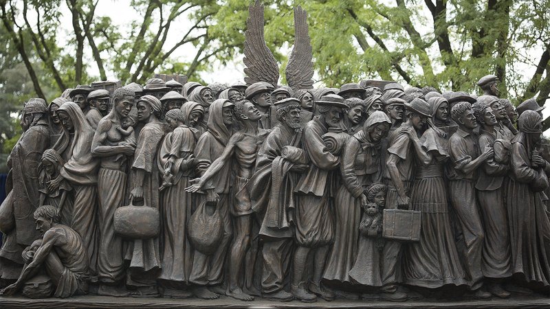 A sculpture called "Angels Unawares" is seen at The Catholic University of America in Washington Sept. 27, 2020. The life-size sculpture, which depicts a group of migrants and refugees crowded on a boat, is a replica of the original one Pope Francis unveiled in St. Peter's Square at the Vatican during the 2019 World Day of Migrants and Refugees. (CNS photo/Tyler Orsburn)