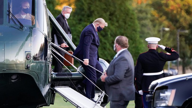U.S. President Donald Trump disembarks from the Marine One helicopter followed by White House Chief of Staff Mark Meadows as he arrives at Walter Reed National Military Medical Center in Bethesda, Md., after after testing positive for COVID-19 Oct. 2, 2020. (CNS photo/Joshua Roberts, Reuters)