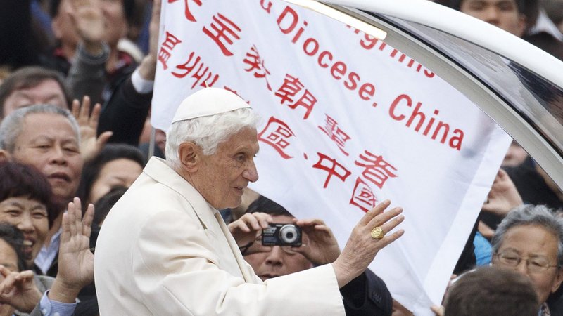 A banner from a diocese in China is seen as Pope Benedict XVI leads his general audience in St. Peter's Square at the Vatican in this April 11, 2011, file photo. Cardinal Pietro Parolin, Vatican secretary of state, said that Pope Benedict XVI also approved of the Vatican-China agreement on bishops that Pope Francis plans to renew. (CNS photo/Paul Haring)