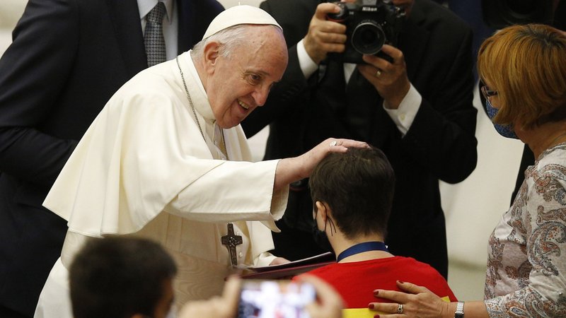 Pope Francis greets a pilgrim during his general audience in Paul VI hall at the Vatican Oct. 7, 2020. (CNS photo/Paul Haring)