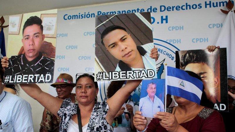 Relatives hold pictures during a 2019 news conference in Managua to demand the release of the demonstrators detained during 2018 protests against the government. (CNS photo/Oswaldo Rivas, Reuters)