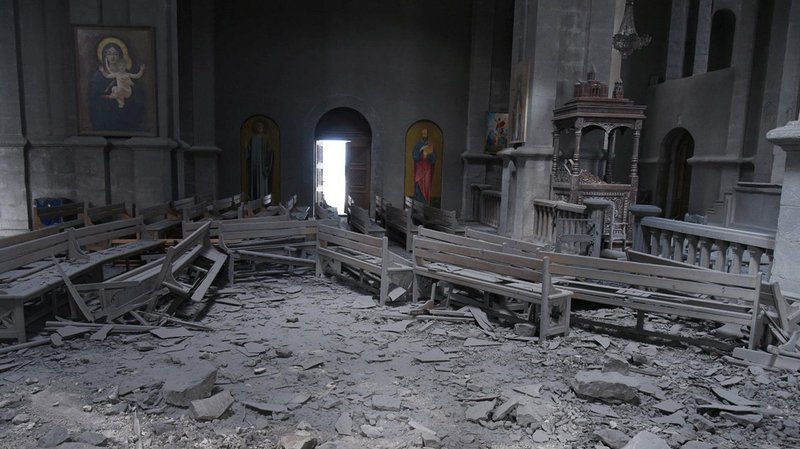 Damaged pews lie amid rubble inside Holy Savior Cathedral in Shusha, Azerbaijan, Oct. 8, 2020, after shelling during a military conflict. Armenian Archbishop Raphael Minassian is pleading for European help in getting Armenia and Azerbaijan to cease fire in their conflict over Nagorno-Karabakh. (CNS photo/David Ghahramanyan, NKR InfoCenter/PAN handout via Reuters)