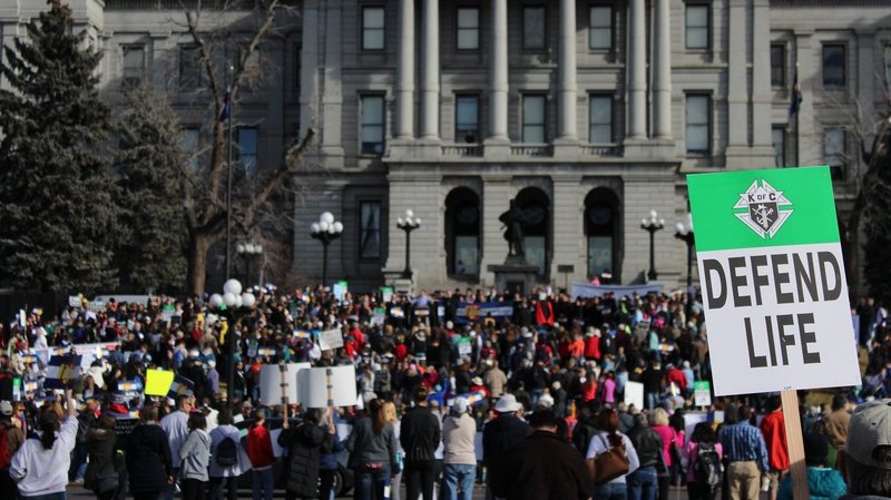 A participant holds a sign during the March for Life rally in front of the Colorado Capitol in Denver Jan. 17, 2015. (CNS photo/Eileen Walsh)