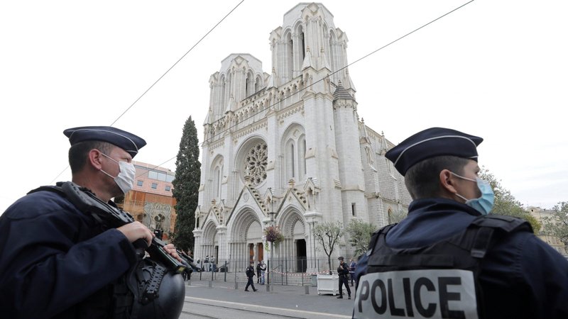 Police stand near Notre Dame Basilica in Nice, France, Oct. 29, 2020, after at least three people were killed in a series of stabbings before Mass. France raised its alert level to maximum after the attack. (CNS photo/Eric Gaillard, pool via Reuters)