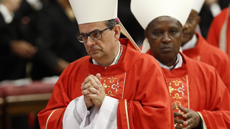 Archbishop Paolo Lojudice of Siena, Italy (left) and Archbishop Antoine Kambanda of Kigali, Rwanda are seen during a Mass marking the feast of Sts. Peter and Paul in St. Peter's Basilica at the Vatican June 29, 2019. Both are among the 13 new cardinals named by Pope Francis Oct. 25. (CNS photo/Paul Haring)