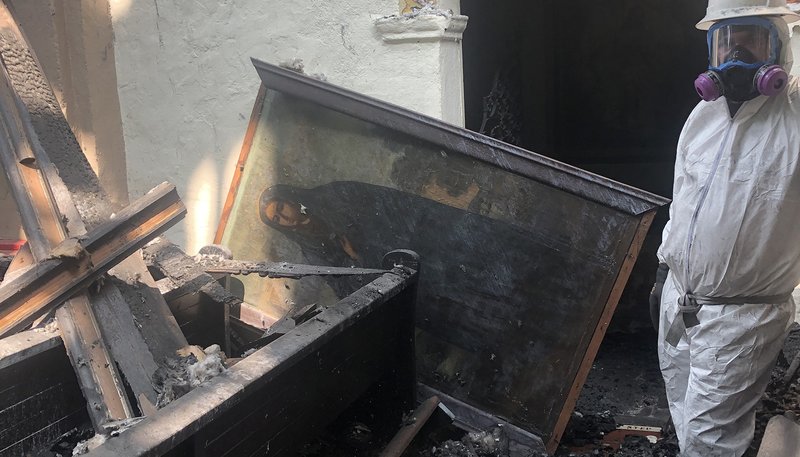 A centuries-old mysterious painting of “La Dolorosa” was pulled out of the rubble of the fire-wrecked Mission San Gabriel on Sept. 15, the feast of Our Lady of Our Sorrows. (Daniel Macias)