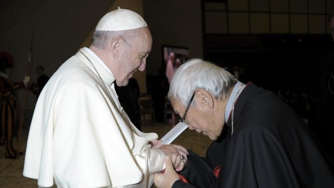 In this Jan. 10, 2018 file photo made available the Vatican newspaper L'Osservatore Romano, retired archbishop of Hong Kong Cardinal Joseph Zen greets Pope Francis at the end of his weekly general audience in Paul VI, at the Vatican. (L'Osservatore Romano/Pool Photo via AP via Crux)