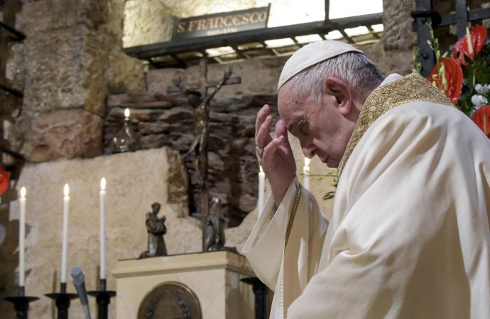 Pope Francis celebrates Mass in the crypt of the Basilica of St. Francis, in Assisi, Italy, Saturday, Oct. 3, 2020. Pope Francis travelled to the homeland of his nature-loving namesake on Saturday to sign an encyclical laying out his vision of a post-COVID world built on solidarity, fraternity and care for the environment. In his first outing from Rome since the coronavirus lockdown, Francis celebrated Mass on Saturday in the crypt of the Basilica of St. Francis in the Umbrian hilltop town of Assisi. (Vatican Media via AP)