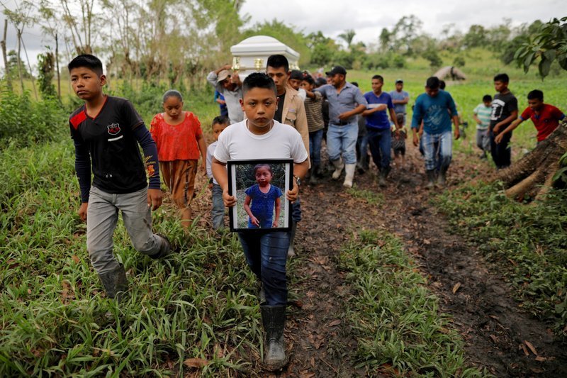 Friends and family carry the casket of Jakelin Caal Maquin during her burial on Christmas Day 2018 in San Antonio Secortez, Guatemala. (Catholic News Service/Carlos Barria, Reuters)