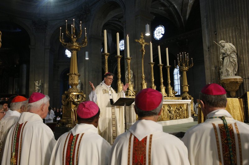 Archbishop Michel Aupetit of Paris celebrates the annual chrism Mass at historic St. Sulpice Church April 17, 2019, in the wake of the massive fire that seriously damaged the historic Notre Dame Cathedral. (CNS photo/Paul Haring)
