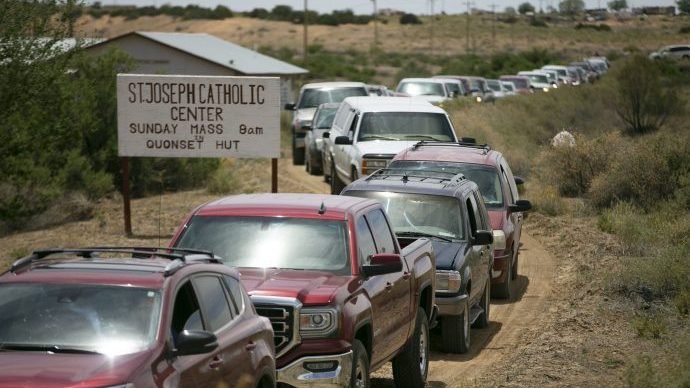 Cars in Coyote Canyon, N.M., on the Navajo reservation, line up to receive food at a food distribution point before the start of a weekend-long curfew May 15, 2020, during the coronavirus pandemic. (David Wallace/The Republic, USA TODAY NETWORK, Reuters/CNS via Crux)
