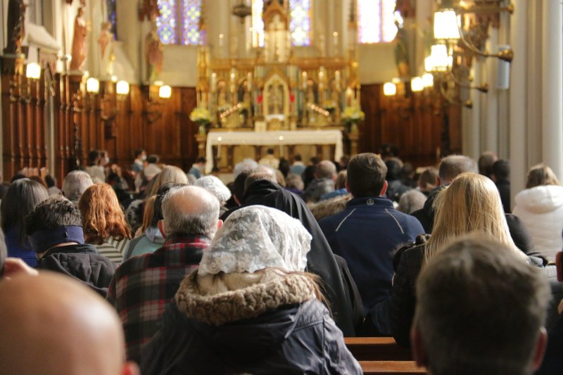 People pray at St. Joseph Shrine in Detroit at the end of a Unite Our Nation procession Oct. 31, 2020. The procession was part of a nationwide campaign to take Christ to the streets before the presidential election. (CNS photo/Dan Meloy, Detroit Catholic)