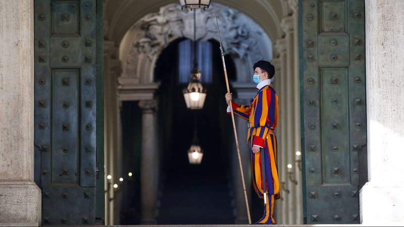 A Swiss Guard stands at a Vatican entrance Nov. 9, 2020, the day before the Vatican released its long-awaited report on ex-Cardinal Theodore McCarrick. (CNS photo/Remo Casilli, Reuters)