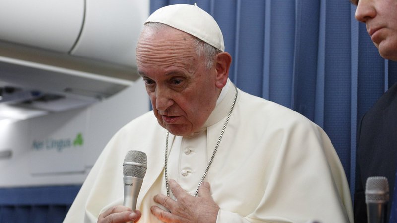 A shaft of light illuminates Pope Francis as he responds to a question from reporter Anna Matranga of CBS News aboard his flight from Dublin to Rome in this Aug. 26, 2018, file photo. Matranga asked the pope about a statement made by Italian Archbishop Carlo Maria Vigano, the former apostolic nuncio to the United States, concerning Archbishop Theodore E. McCarrick. The pope declined to respond to the charges. (CNS photo/Paul Haring)