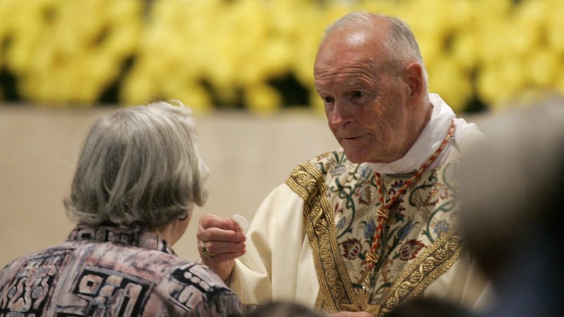Then-Cardinal Theodore E. McCarrick of Washington gives Communion during a Mass with U.S. cardinals at the Basilica of the National Shrine of the Immaculate Conception in Washington in this April 28, 2006, file photo. (CNS photo/Paul Haring)