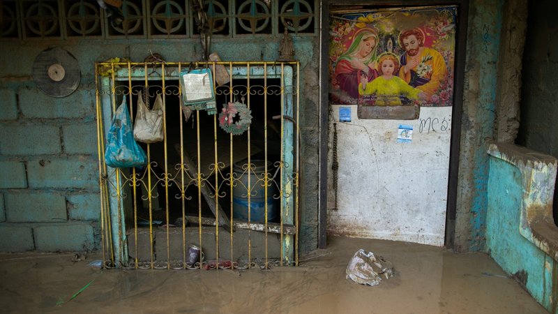 An image of the Holy Family is pictured on a house partially submerged in Manila, Philippines, Nov. 13, 2020, after flooding caused by Typhoon Vamco. Five tropical storms or typhoons have hit the Philippines in a three-week period, including the strongest typhoon since 2013 and the biggest floods since 2009. (CNS photo/Eloisa Lopez, Reuters)