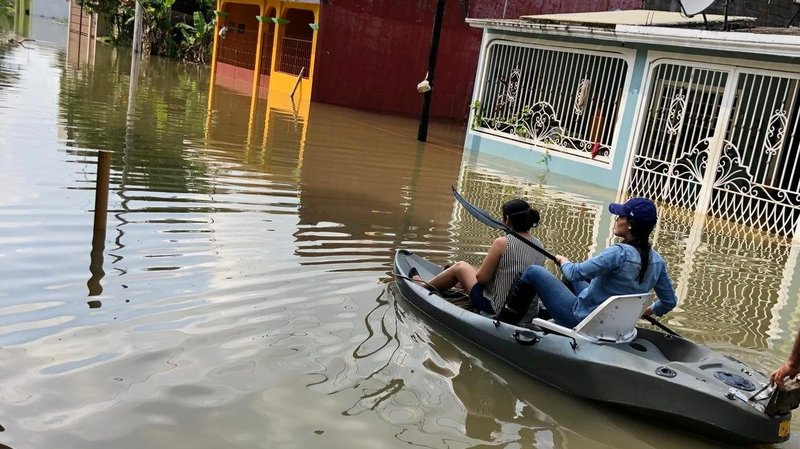 People use a kayak to move through floodwaters in Macuspana, Mexico, Nov. 9, 2020, in the aftermath of Tropical Storm Eta in this picture obtained from social media. An estimated 200 people died throughout Central America and southern Mexico because of Eta, and Hurricane Iota was due to make landfall in Central America in the same place as Eta. (CNS photo/Jesus Castellanos Perez via Reuters)