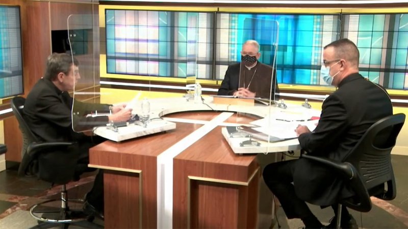 Detroit Archbishop Allen H. Vigneron, vice president of the U.S. Conference of Catholic Bishops, Los Angeles Archbishop José H. Gomez, USCCB president, and Msgr. J. Brian Bransfield, outgoing USCCB general secretary, converse Nov. 16, 2020, in the studio at USCCB headquarters in Washington. They were in the studio for the bishops' fall general assembly, convened virtually due to the coronavirus pandemic. (CNS photo/Screen Grab)